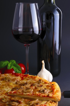still life with pizza and red wineの写真素材