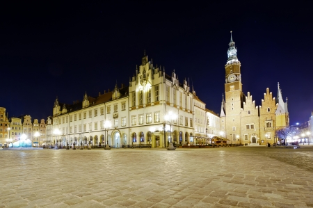 old and new city hall in wroclaw, poland, at nightのeditorial素材