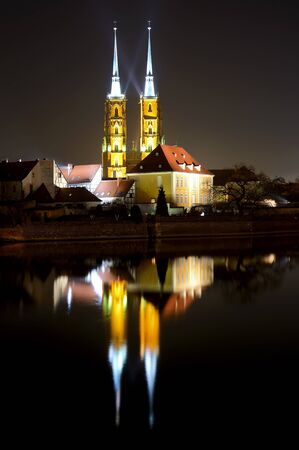 saint john the baptist cathedral in wroclaw, poland, at nightの写真素材
