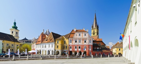 panorama with colorful houses on small square in sibiu, transylvania, romaniaのeditorial素材