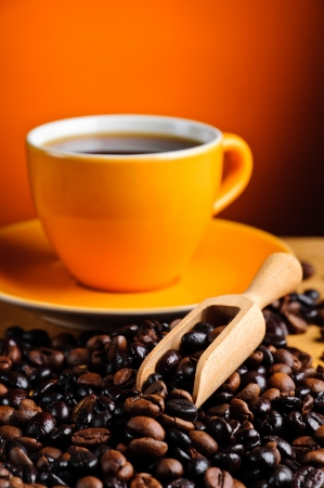 still life with coffee beans closeup and coffee cupの写真素材