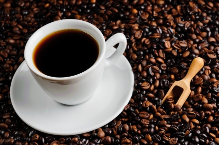 still life with fresh cup of coffee and beansの写真素材