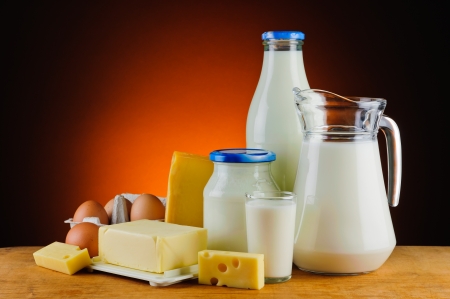 still life with organic dairy products, milk, cheese, butter and eggsの写真素材