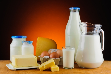 still life with organic dairy products, milk, cheese, butter and eggsの写真素材
