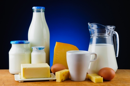 still life with organic dairy products, milk, cheese, butter and eggsの写真素材