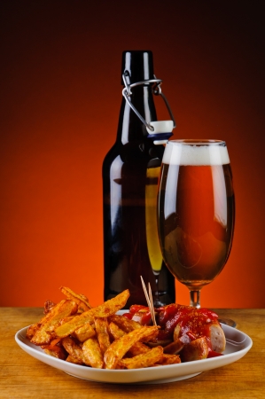 currywurst menu with curry sausages, french fries and beerの写真素材