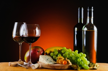 still life with cheese, wine and fresh exotic fruitsの写真素材