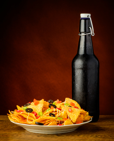 tortilla chips snack with cold beer bottleの写真素材