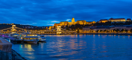 Budapest, Hungary - September 28, 2019: Panorama view with the royal Palace and chain bridge in Budapest at night.のeditorial素材
