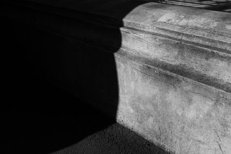 Close up of fence concrete foundation black white architecture detail architectural shadow