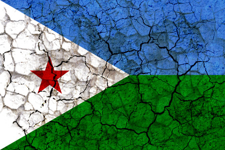djibouti country flag symbol painted on a cracked grungy wall. Concept of drought, hardship, no rain or economic crysisの写真素材