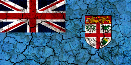 fiji islands country flag symbol painted on a cracked grungy wall. Concept of drought, hardship, no rain or economic crysisの写真素材