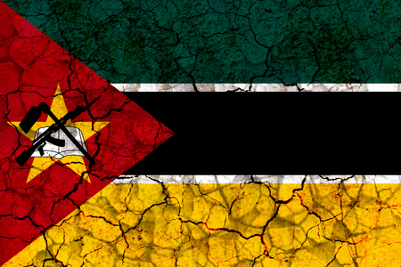 mozambique country flag symbol painted on a cracked grungy wall. Concept of drought, hardship, no rain or economic crisisの写真素材