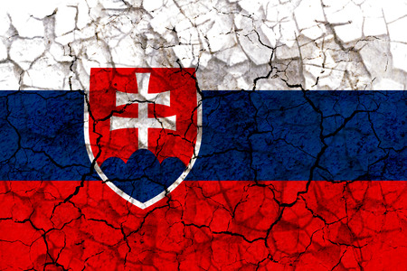 slovakia country flag symbol painted on a cracked grungy wall. Concept of drought, hardship, no rain or economic crisisの写真素材