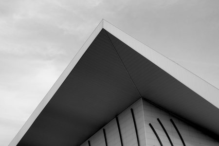 Artistc black and white photography of a building corner. Architecture design detail photo