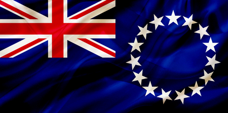 Cook Islands country flag symbol on silk or silky waving texture. Smooth fabric or materialの写真素材
