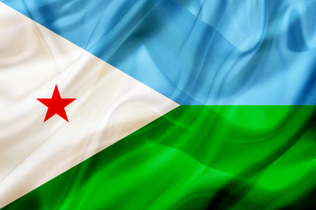 Djibouti country flag symbol on silk or silky waving texture. Smooth fabric or materialの写真素材