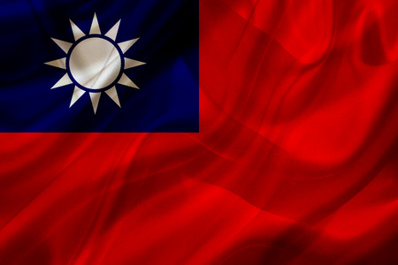 Taiwan country flag symbol on silk or silky waving texture. Smooth fabric or materialの写真素材