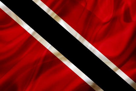 Trinidad and Tobago country flag symbol on silk or silky waving texture. Smooth fabric or materialの写真素材