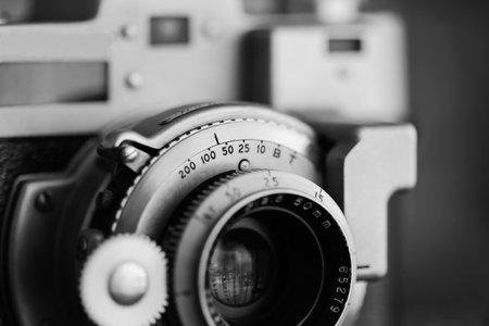 Vintage old photography film camera with lens. Close up macro shot. Antique equipmentの写真素材