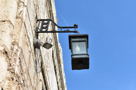 Lantern on the wall of medieval fortress