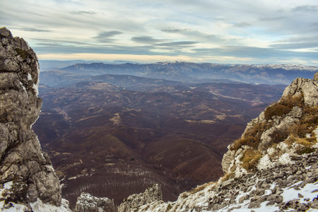 View on the valley from the peak of the rocky mountain - backgroundの写真素材