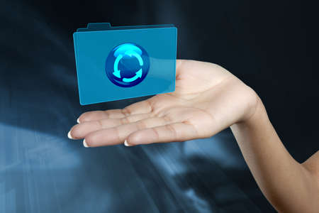 a digital folder floats on a woman s hand の写真素材