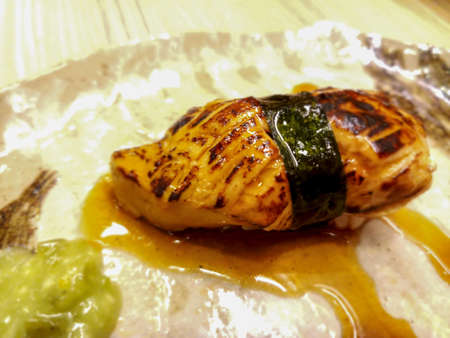 foie gras sushi wrapped in algae and special sauce.Served with wasabi.It has a unique flavor, unlike other types of food.の写真素材