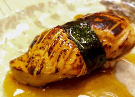 foie gras sushi wrapped in algae and special sauce.It has a unique flavor, unlike other types of food.の写真素材