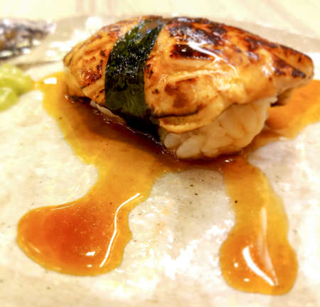 foie gras sushi wrapped in algae and special sauce.It has a unique flavor, unlike other types of food.の写真素材