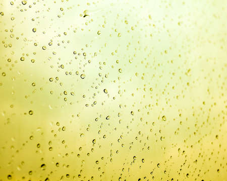 Water drops with the yellow backgroundの写真素材