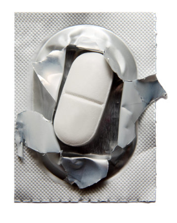Closeup of opened blister pack with one pill.Studio shot.