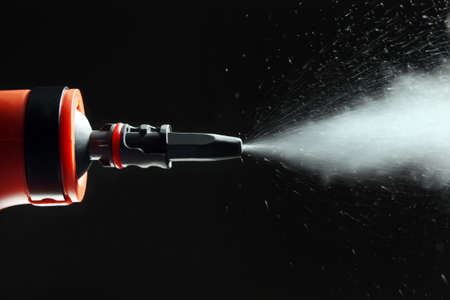 Closeup of steam cleaner isolated on black background.Studio shotの写真素材