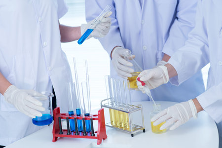 Students at laboratory mixing substances and observing the results