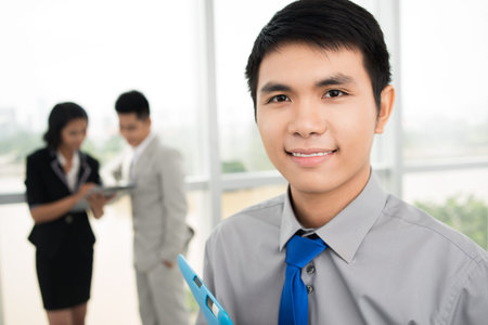 Portrait of a team member smiling at the viewerの写真素材