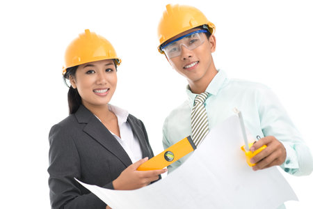 Portrait of a team of architects being ready for work isolated against white background