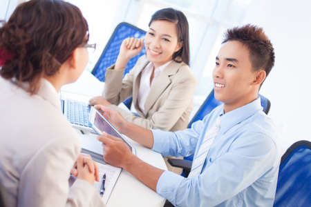 Cheerful business team proving positivity to be a key to successful collaborationの写真素材