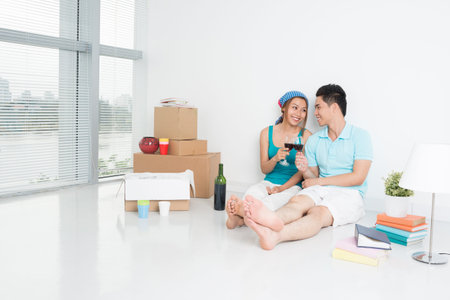 Horizontal image of a couple celebrating their housewarming together