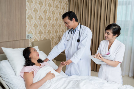Image of doctors comforting his patient