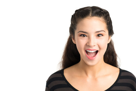Isolated portrait of a young excited girl posing at camera 