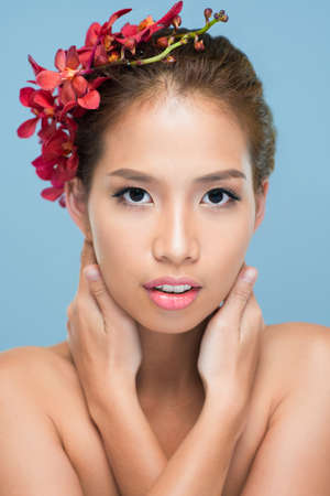 Vertical shot of a posing fashion model with perfect complexionの写真素材