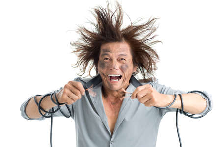 Man holding bared wires and screaming of pain の写真素材