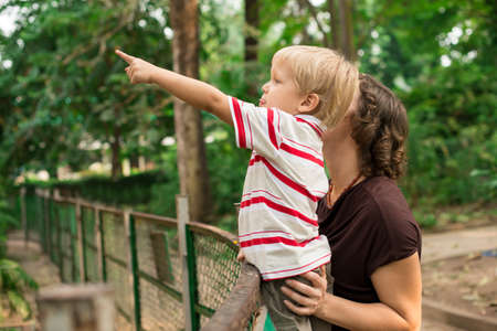 Portrait of a young boy with mom in the zooの写真素材