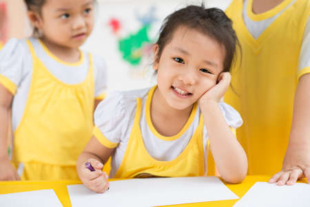 Closeup of a little girl with a pencil in handsの写真素材