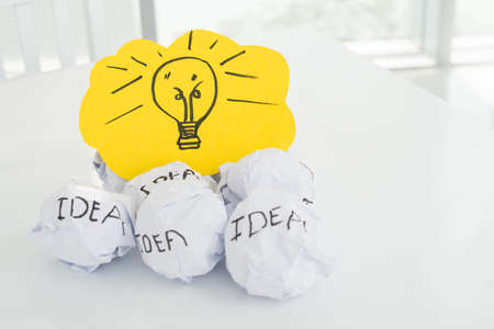 Closeup of paper balls and a paper cardの写真素材