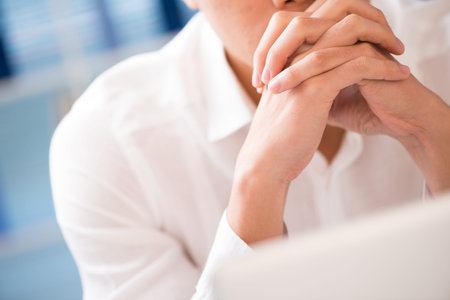 Close-shot of a man contemplating indoorsの写真素材