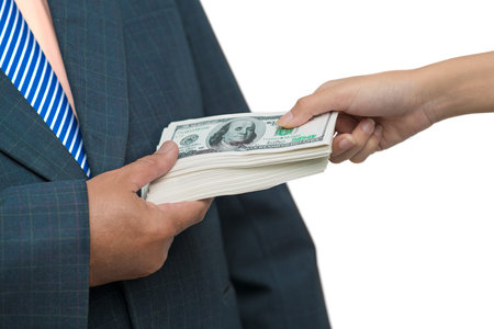 Close up of a male?s hand taking bribe