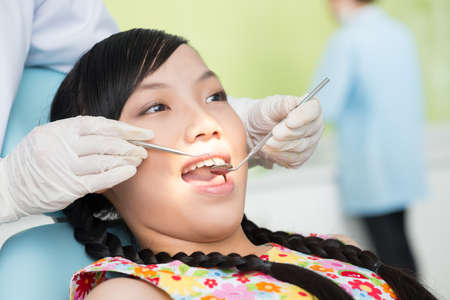 Close-up of a teenager having oral examination in the dental clinicの写真素材