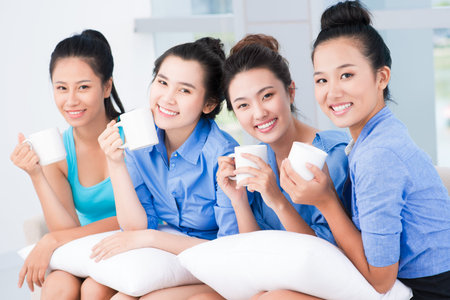 Girlfriends having rest indoorsの写真素材