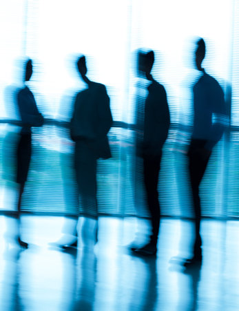 Image of a blurred business team standing at the office